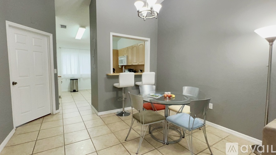 A dining area with a table and chairs is shown.