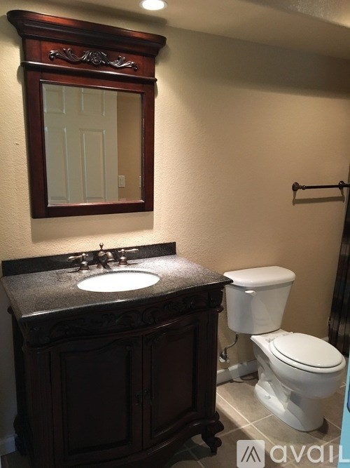 A bathroom with a toilet and sink.