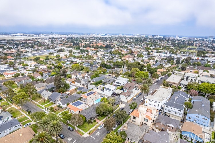 A residential area with houses and trees.
