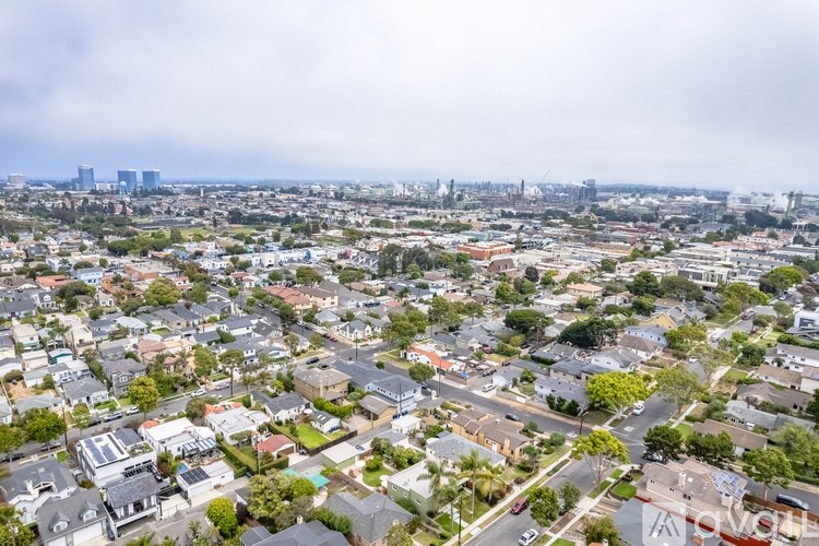 A cityscape with a mix of residential and industrial buildings.