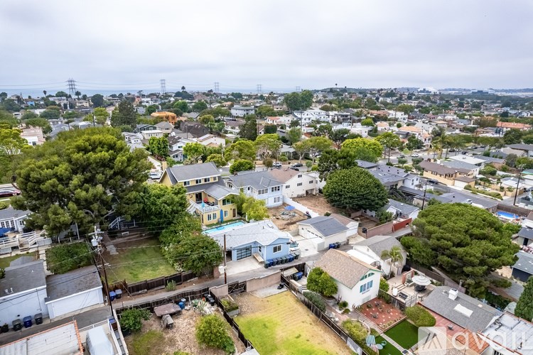 A residential area with houses and trees.