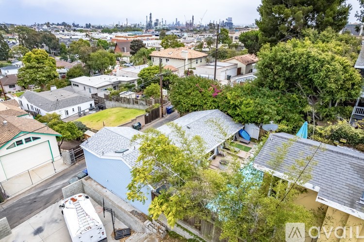 A residential area with houses and trees.