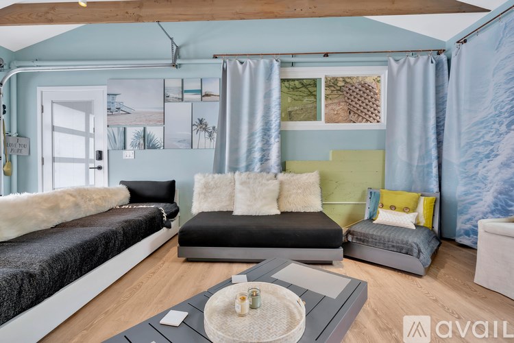 A living room with a grey sofa and a coffee table.