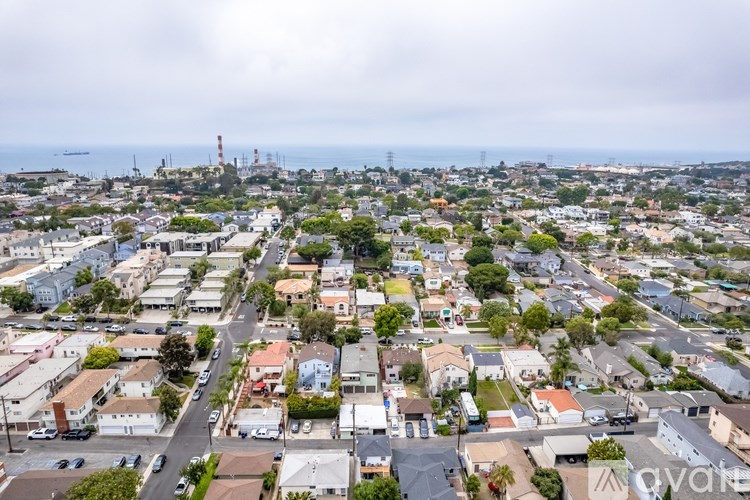 A bird's eye view of a residential area with houses and streets.