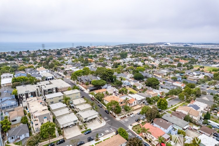 A view of a residential area with houses and streets.
