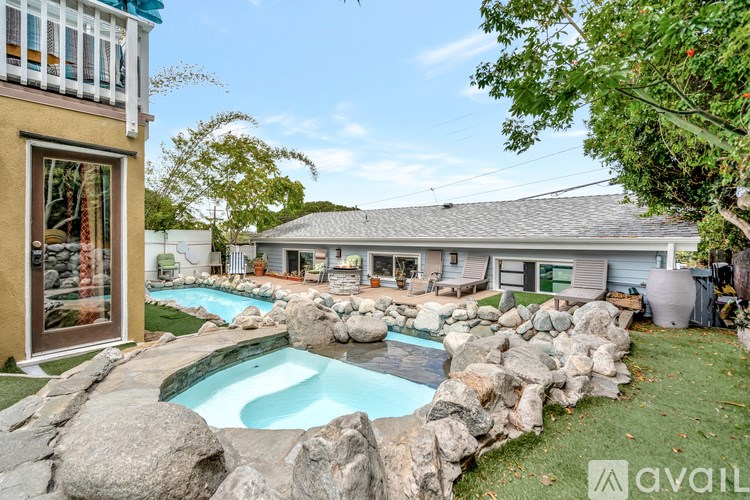 A house with a pool in the backyard.