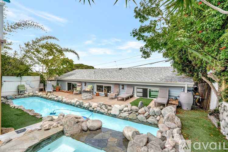 A house with a pool in the backyard.