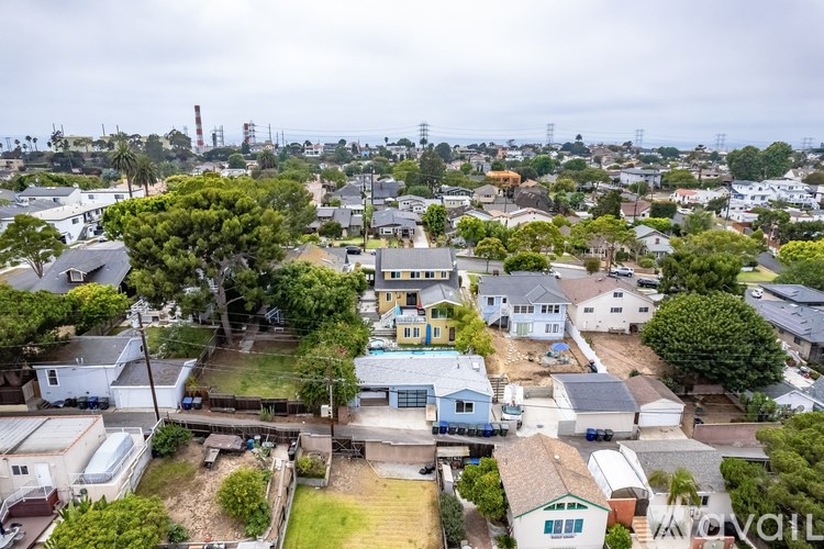 A residential area with houses and trees.