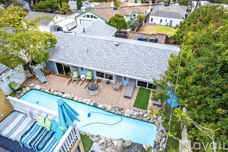 A house with a pool in the backyard.