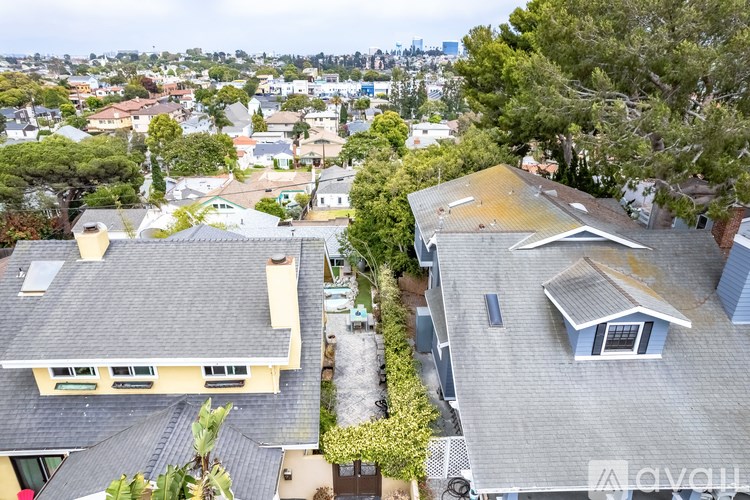 A bird's eye view of a residential area with houses and trees.