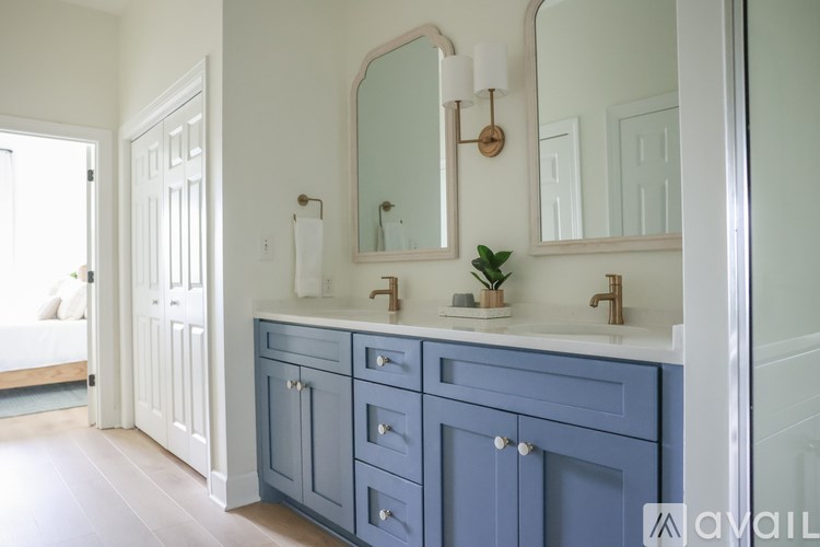 A bathroom with a vanity and a mirror.