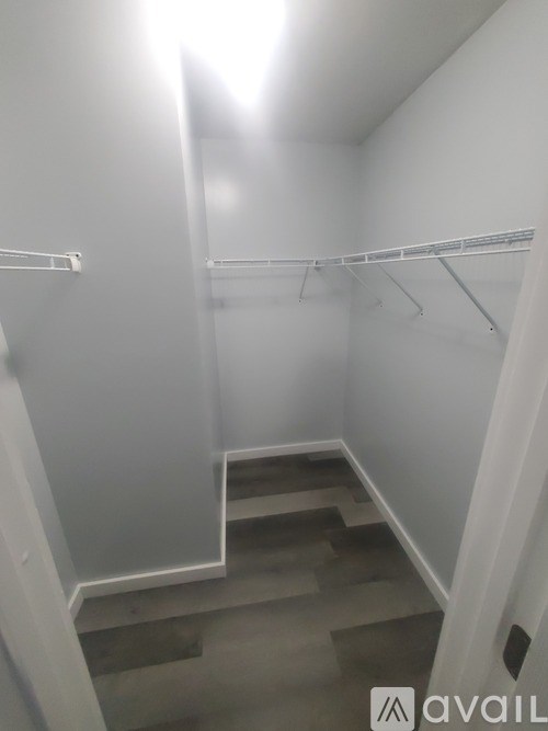 A white hallway with a staircase leading to the second floor.