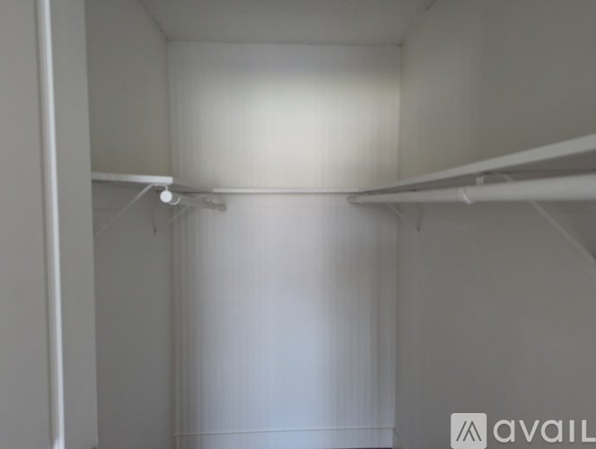 A white room with a light on the ceiling.