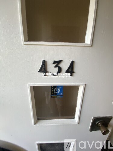 A white door with a number 434 on it.