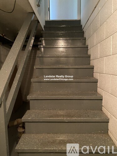 A set of stairs with a text overlay that reads "Landstar Realty Group www.LandstarChicago.com".