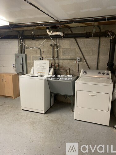 A room with a printer and a copier on the floor.