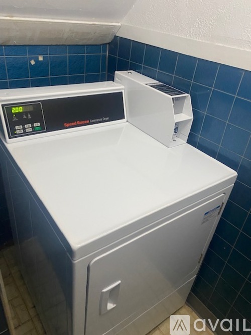 A white washing machine with a digital display on the front.