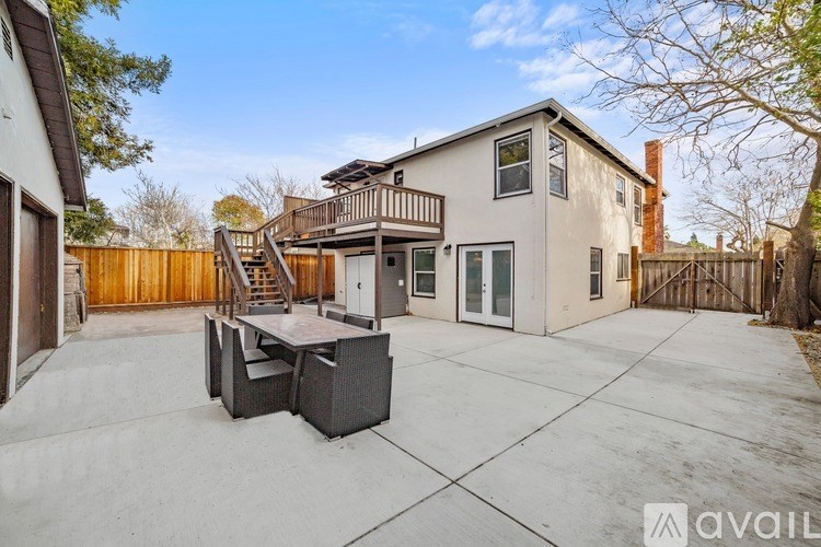 A house with a patio and a hot tub.