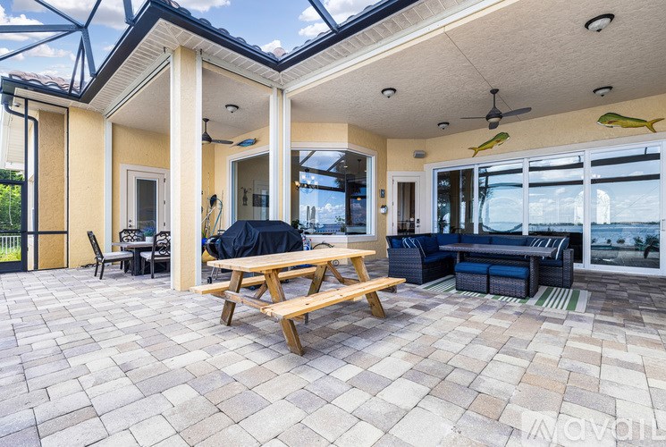 A patio with a table and chairs is shown.