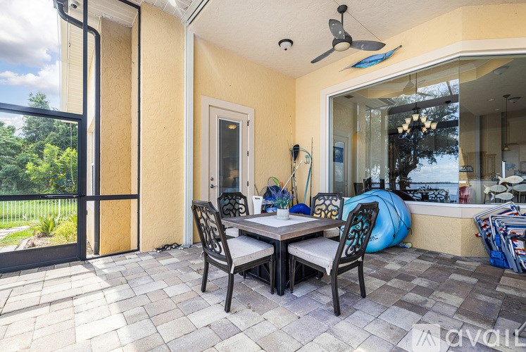 A patio with a table and chairs is shown.