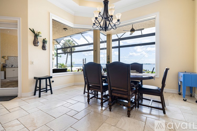 A dining room with a table set for four.