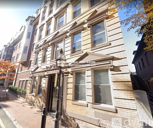 A building with a brown facade and a sign that says "Edwardian Premier Estate".