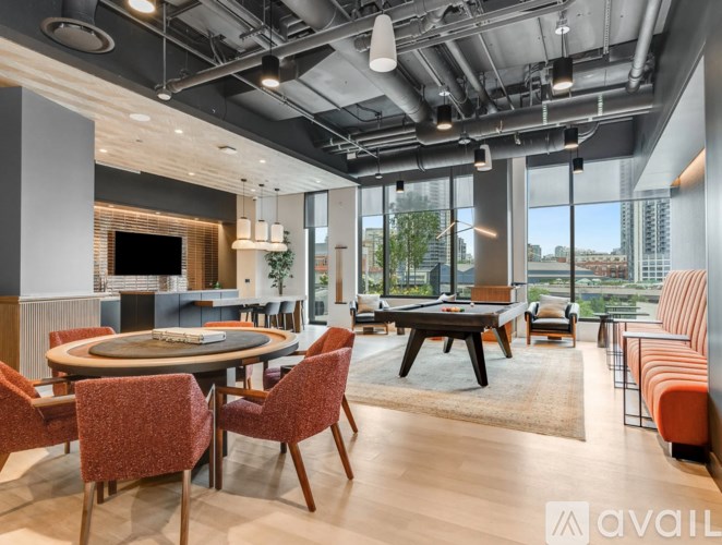 A modern dining room with a pool view.