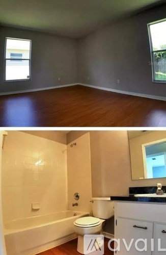 A room with a toilet and a bathtub in it.