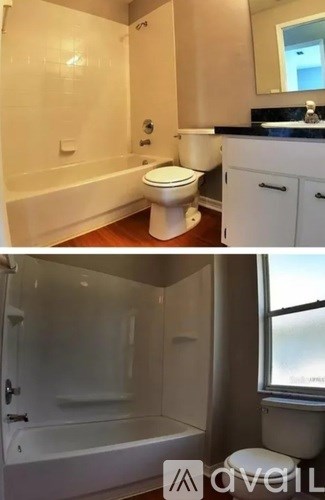 A white bathroom with a toilet, sink, and bathtub.
