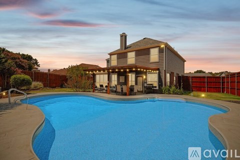 A house with a pool in the backyard.