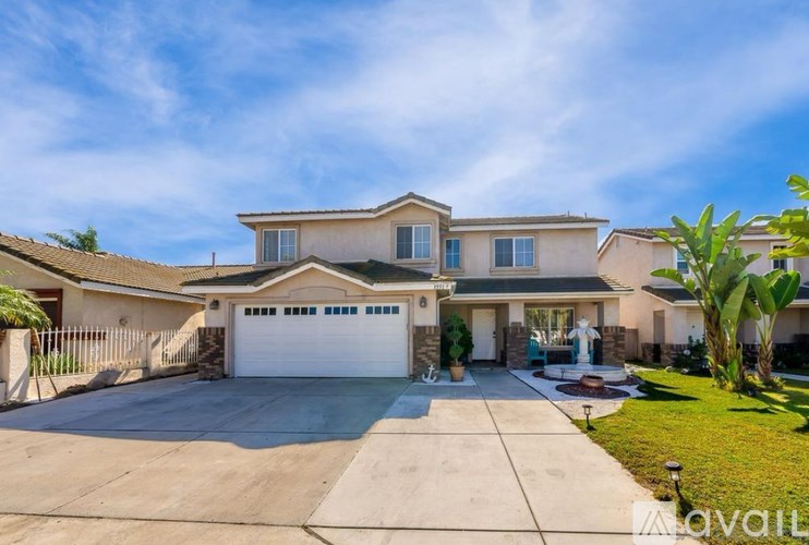 A large house with a garage is for sale.