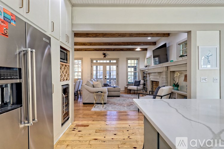A kitchen with a refrigerator and a counter top.
