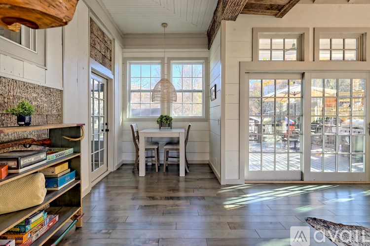 A dining room with a table and chairs is shown.