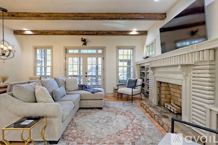 A living room with a fireplace and a couch.