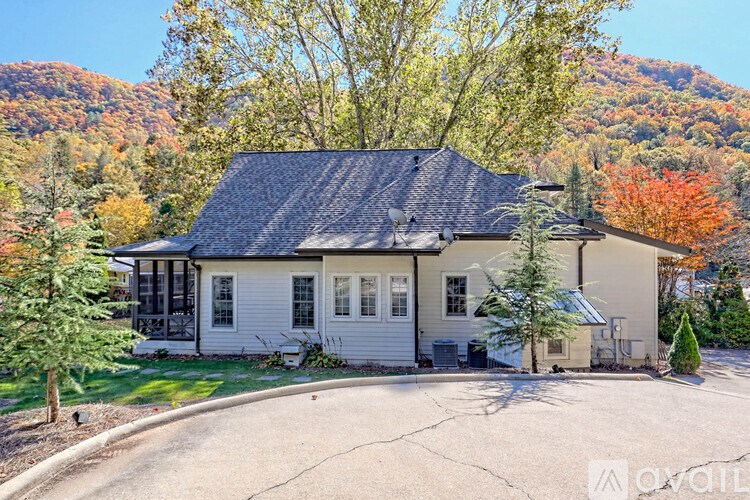 A house with a mountain in the background.