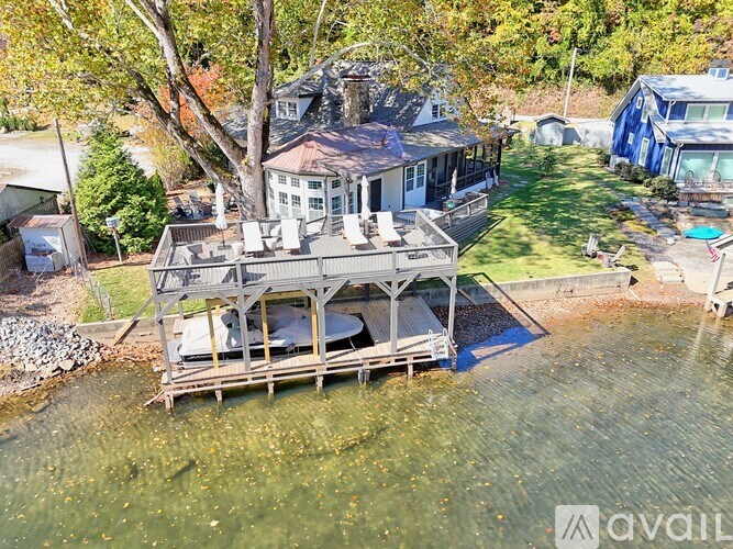 A house with a deck over water.