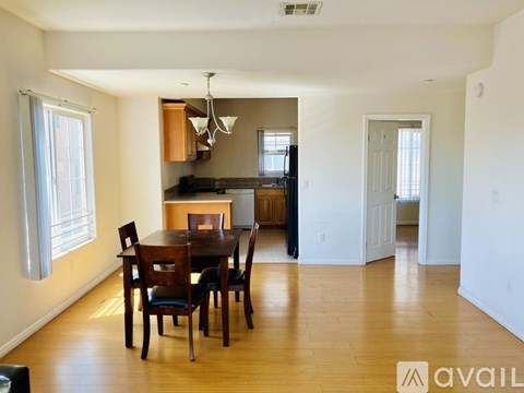 A dining room with a table and chairs is available for rent.