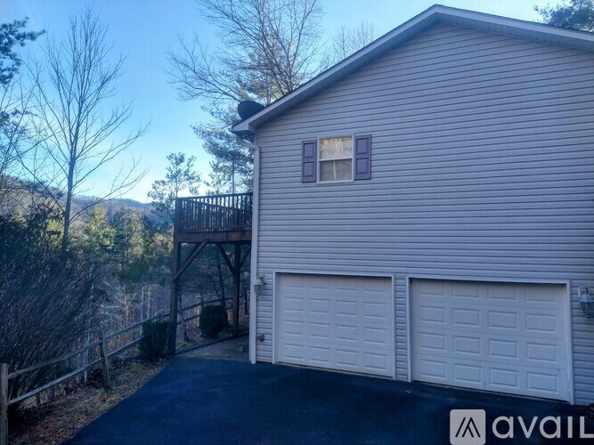 A house with a garage and a driveway.