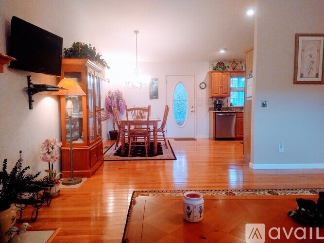 A living room with wooden floors and furniture.