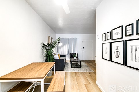 A room with a table and chairs in it.