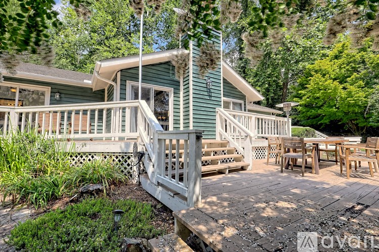 A house with a deck and a white railing.