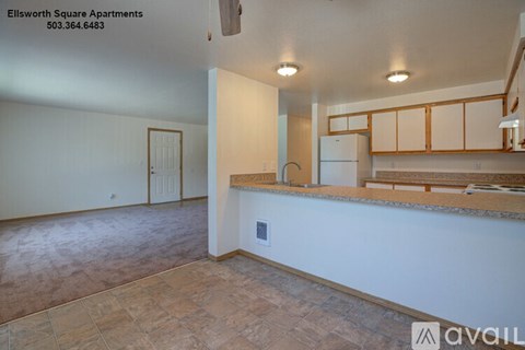 A kitchen area with a counter and cabinets is available for rent.