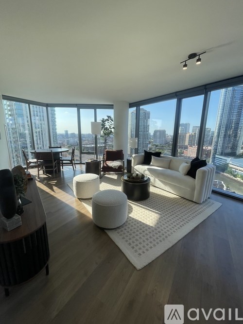 A living room with a view of the city skyline.