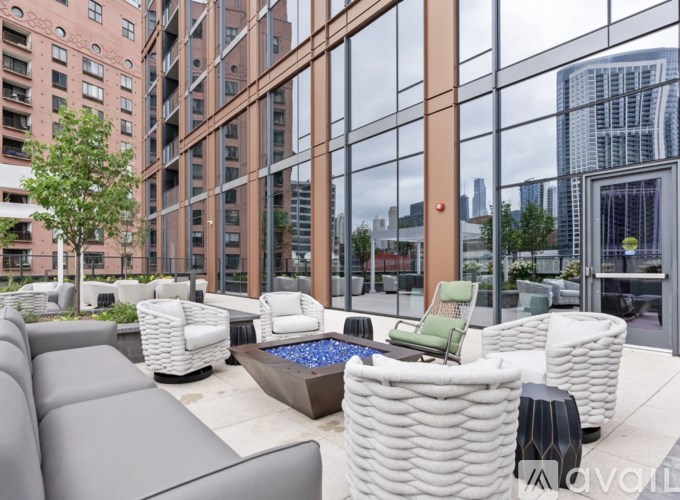 A patio with white furniture and a pool table.