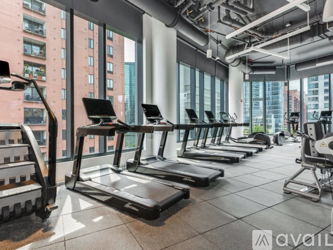 A gym with treadmills and other equipment is available for use.