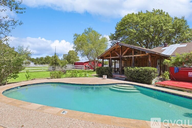 A house with a pool in the backyard.