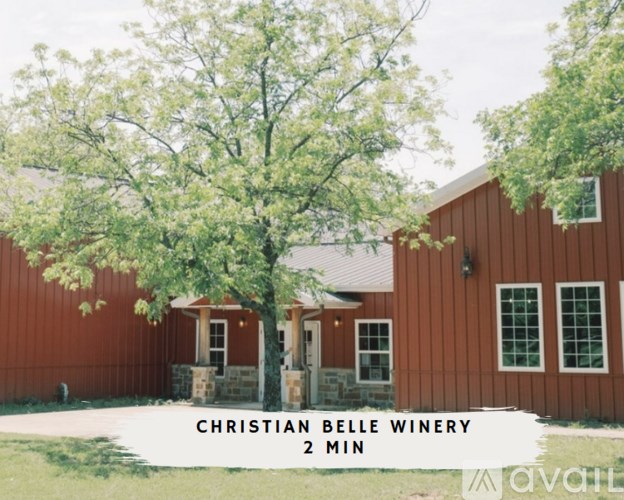 A red building with the words Christian Belle Winery 2 min on it.
