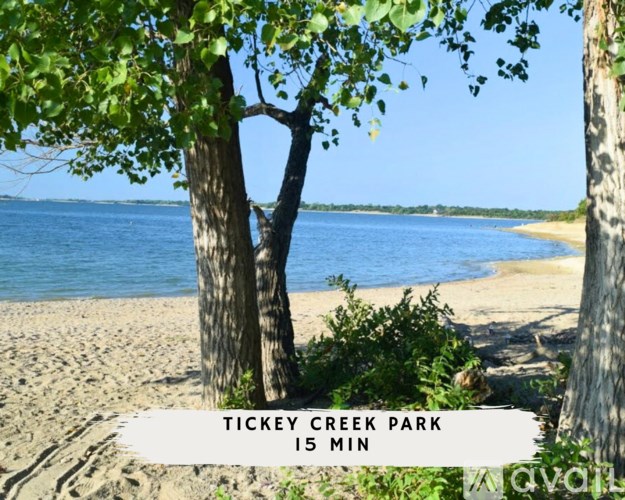 A sign at the beach reads "Tickey Creek Park 15 min.".