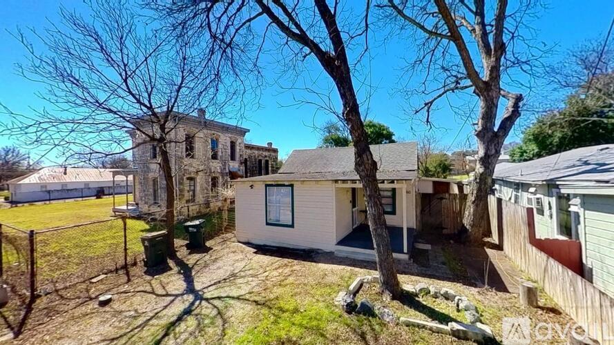 A house with a tree in front of it.