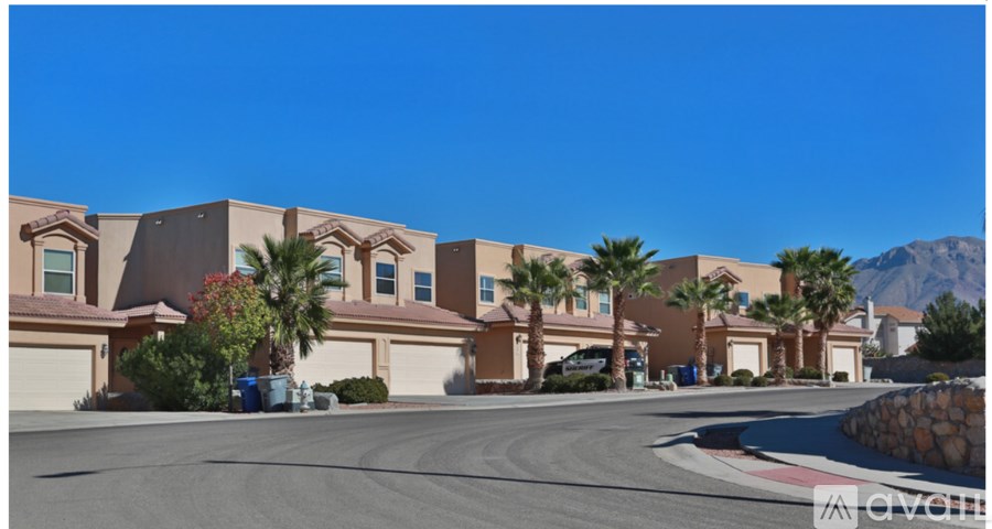 A row of houses with a mountain in the background.